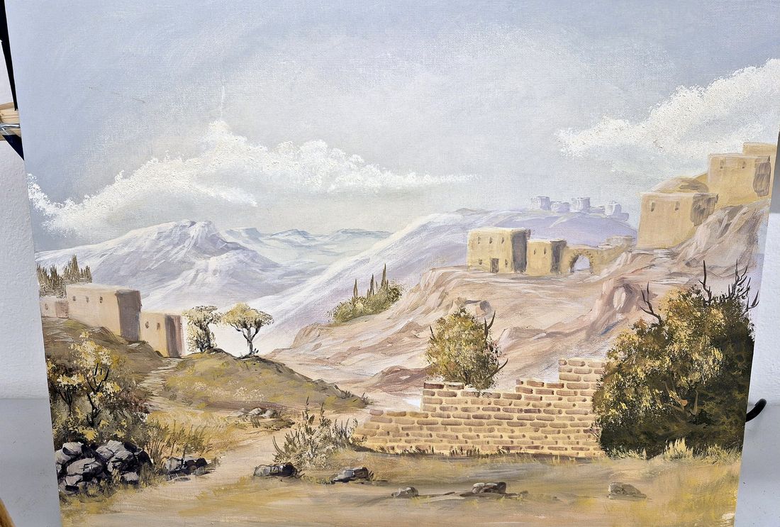 Orientalische Landschaft mit Lehmhäusern, Mauer und Bergen